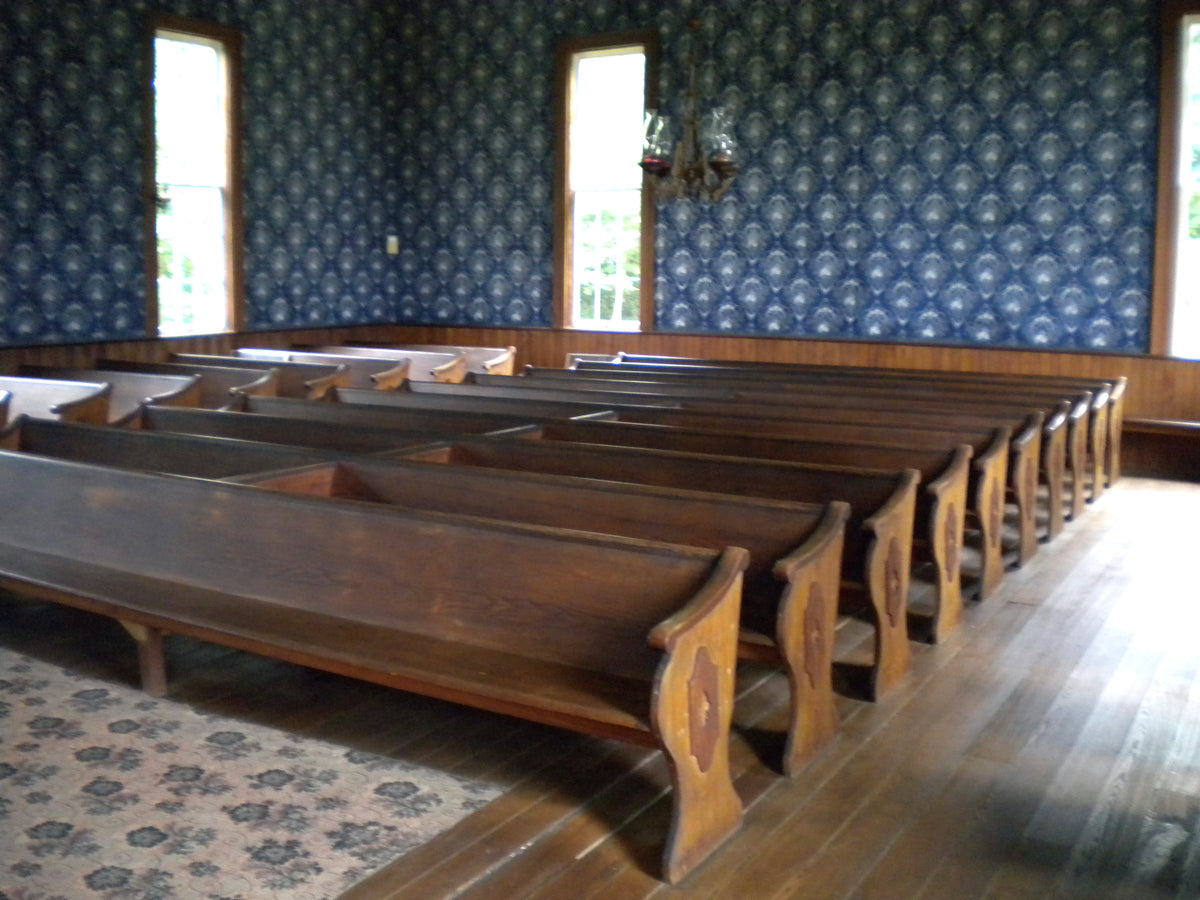 Wooden pews and aisles at Powers Church; a seating-layout example