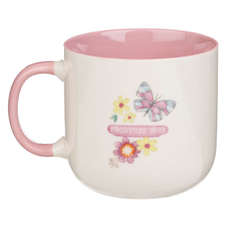 A Glad Heart Makes a Cheerful Face Pink Ceramic Mug - Proverbs 15:13 by Christian Art Gifts, product view 2