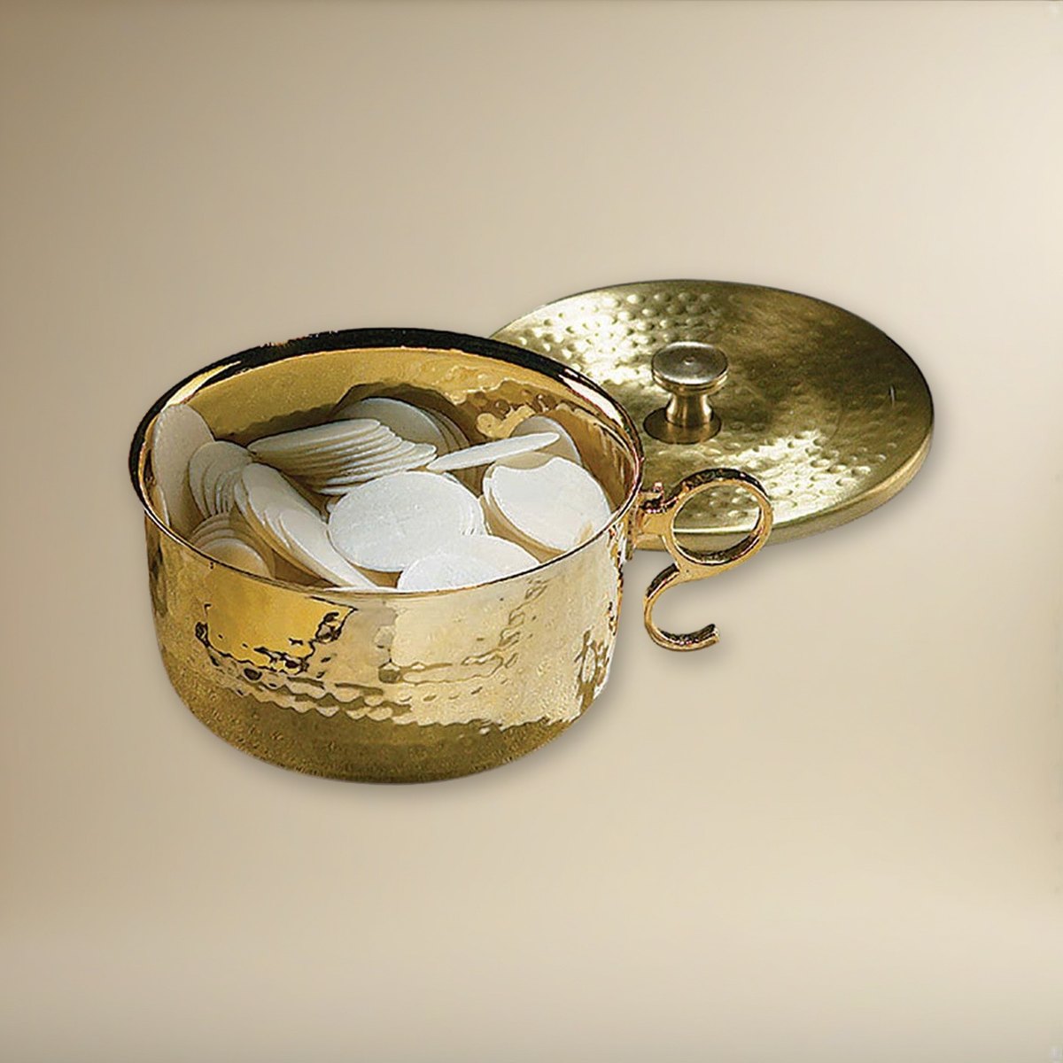 1000 Host Brass Stacking Ciborium with Lid on a cream backdrop