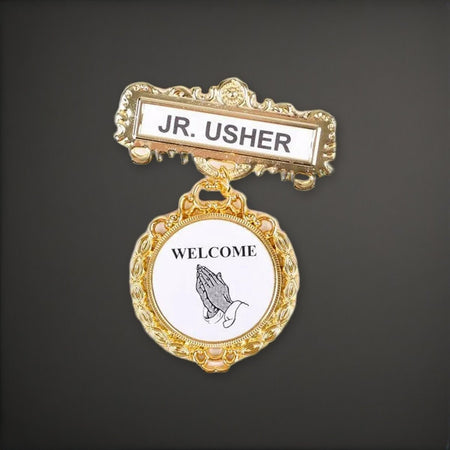 Badge Fancy Round Jr Usher Ethnic Praying Hand Magnet on a charcoal backdrop