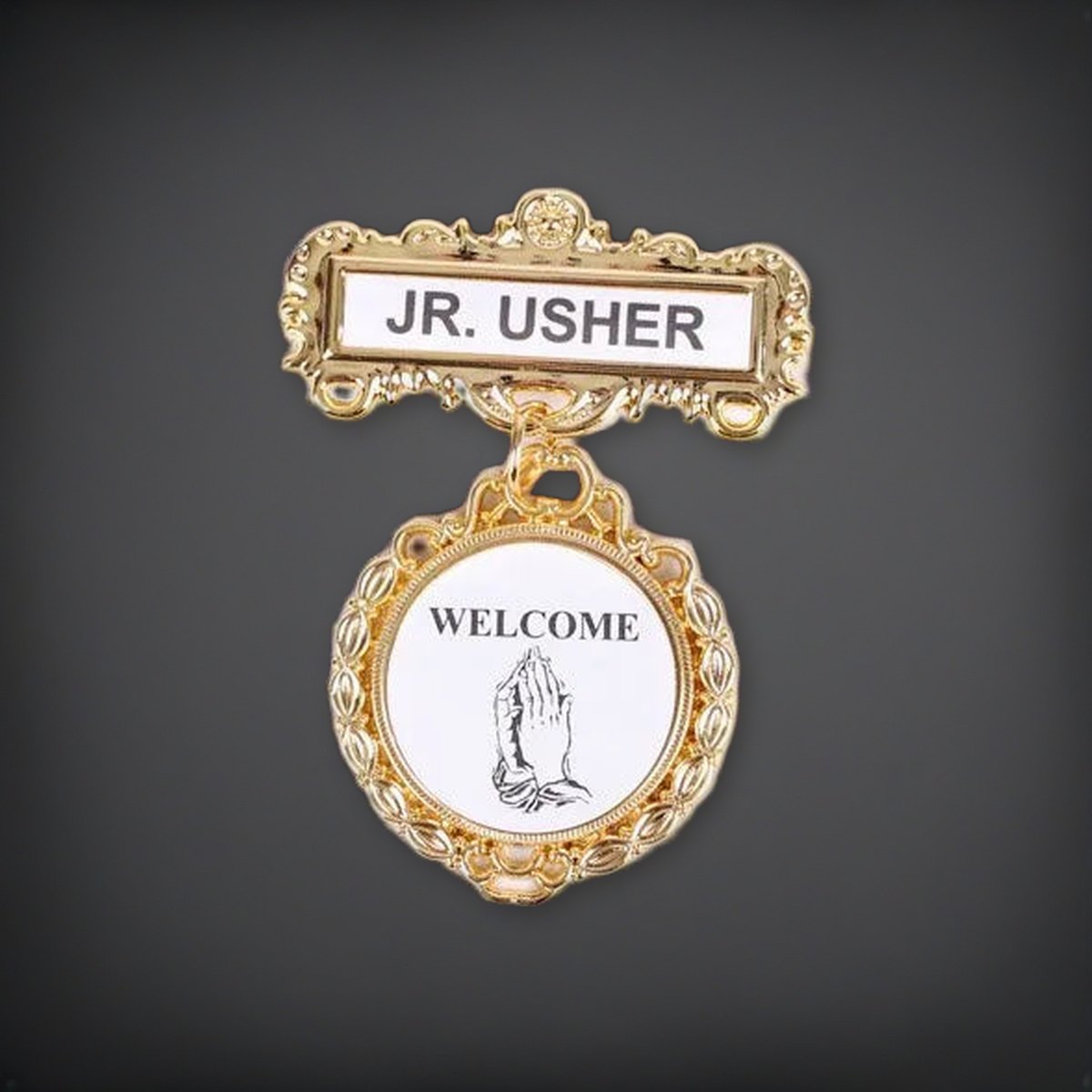 Badge - Fancy Round - Jr. Usher - Praying Hands Welcome - Pin on a charcoal backdrop