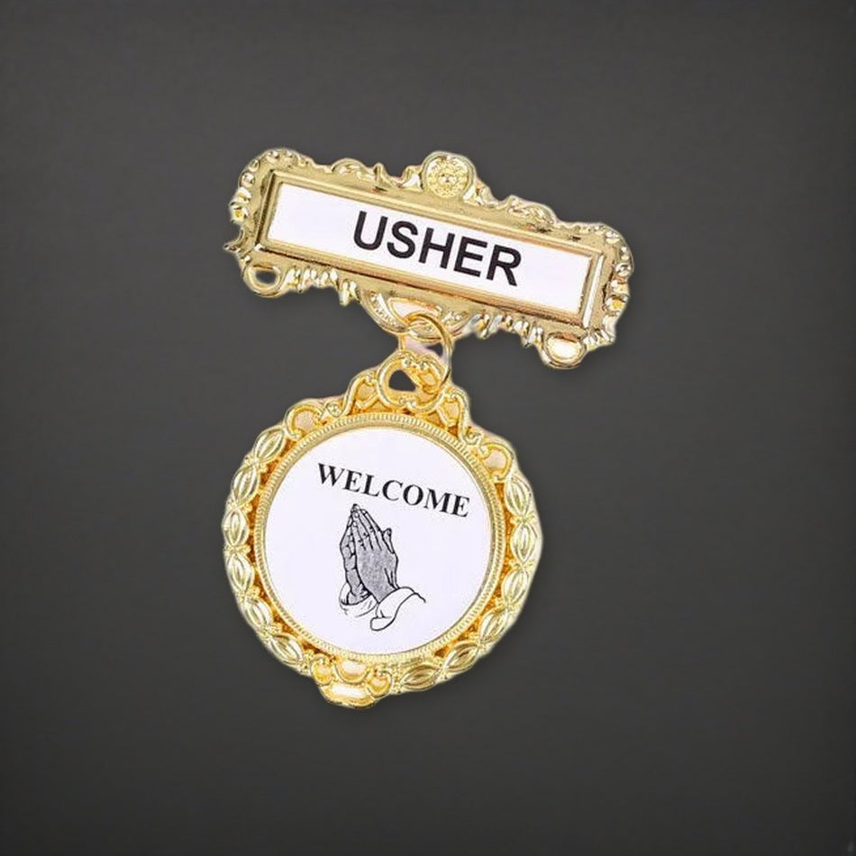 Badge Fancy Round Usher Ethnic Praying Hands Pin on a charcoal backdrop