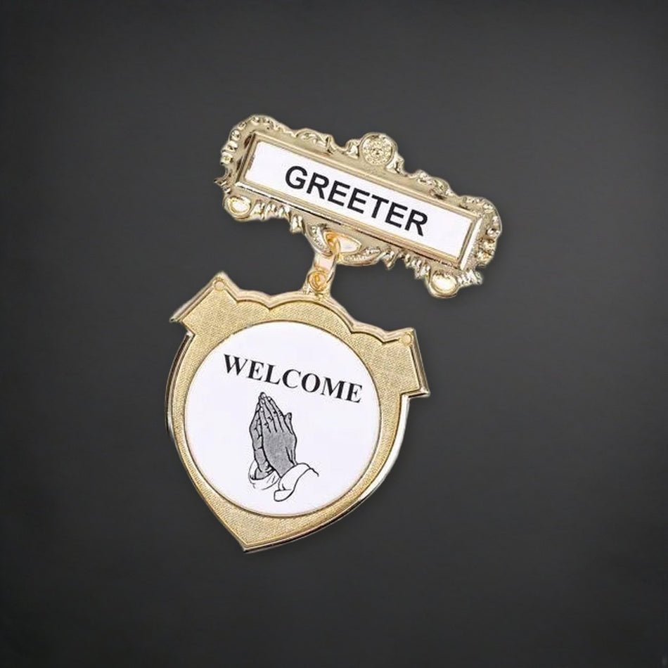 Badge Shield Greeter Ethnic Praying Hands Pin on a charcoal backdrop
