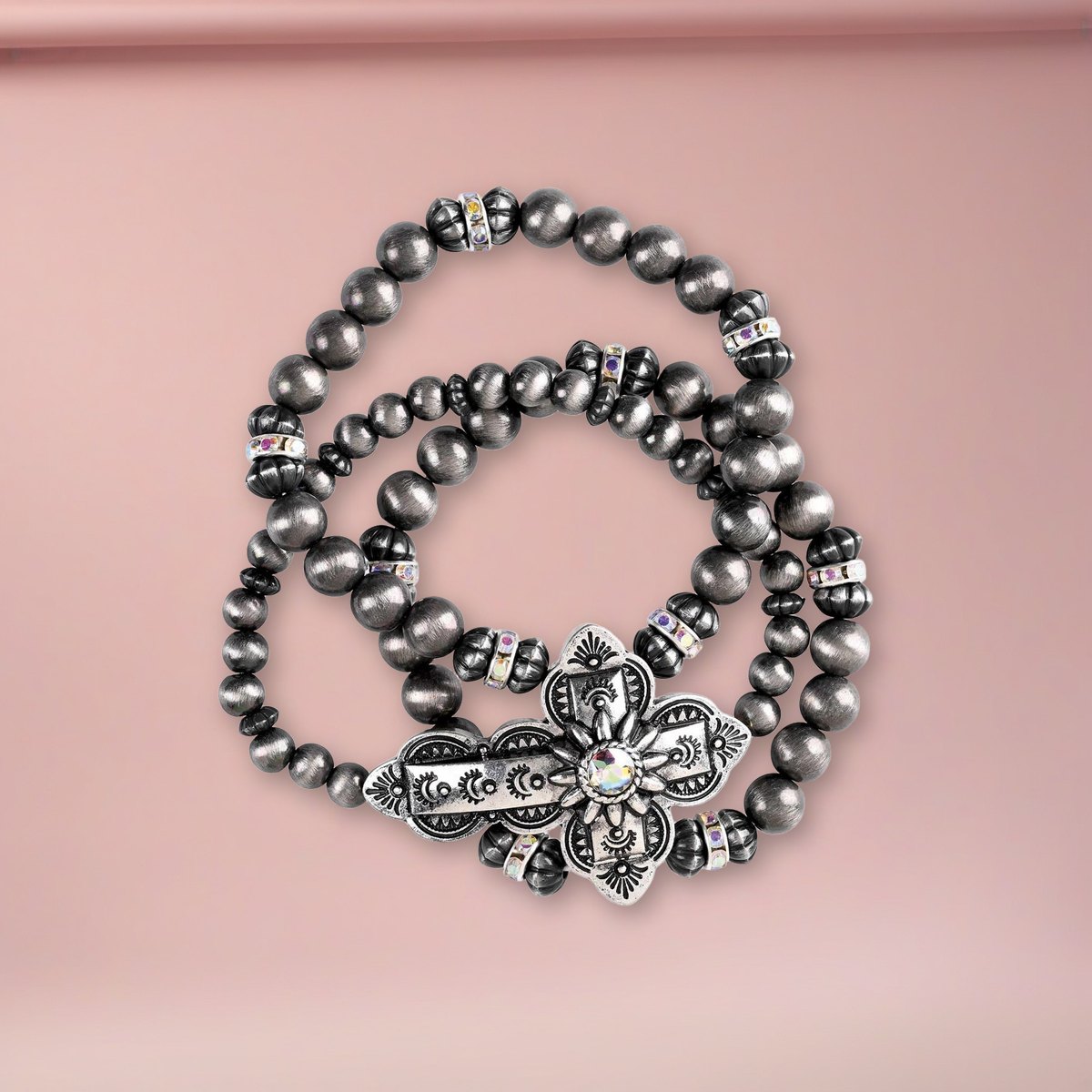 Bracelet Triple Stack Sideway Cross on a blush pink backdrop