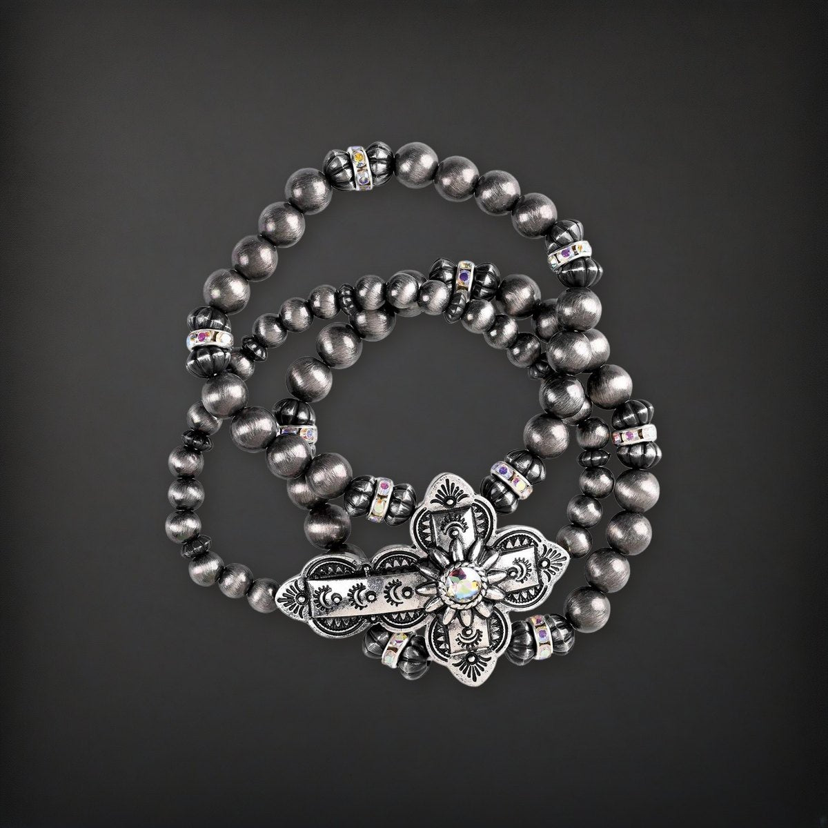 Bracelet Triple Stack Sideway Cross on a charcoal backdrop