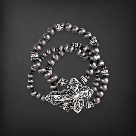 Bracelet Triple Stack Sideway Cross on a charcoal backdrop