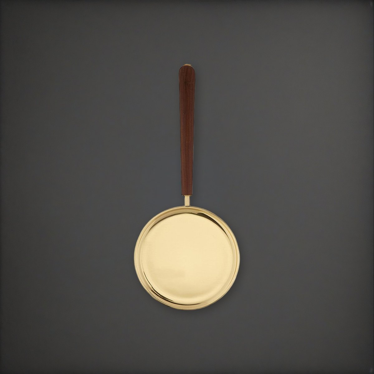Brass Paten with Straight Handle on a charcoal backdrop