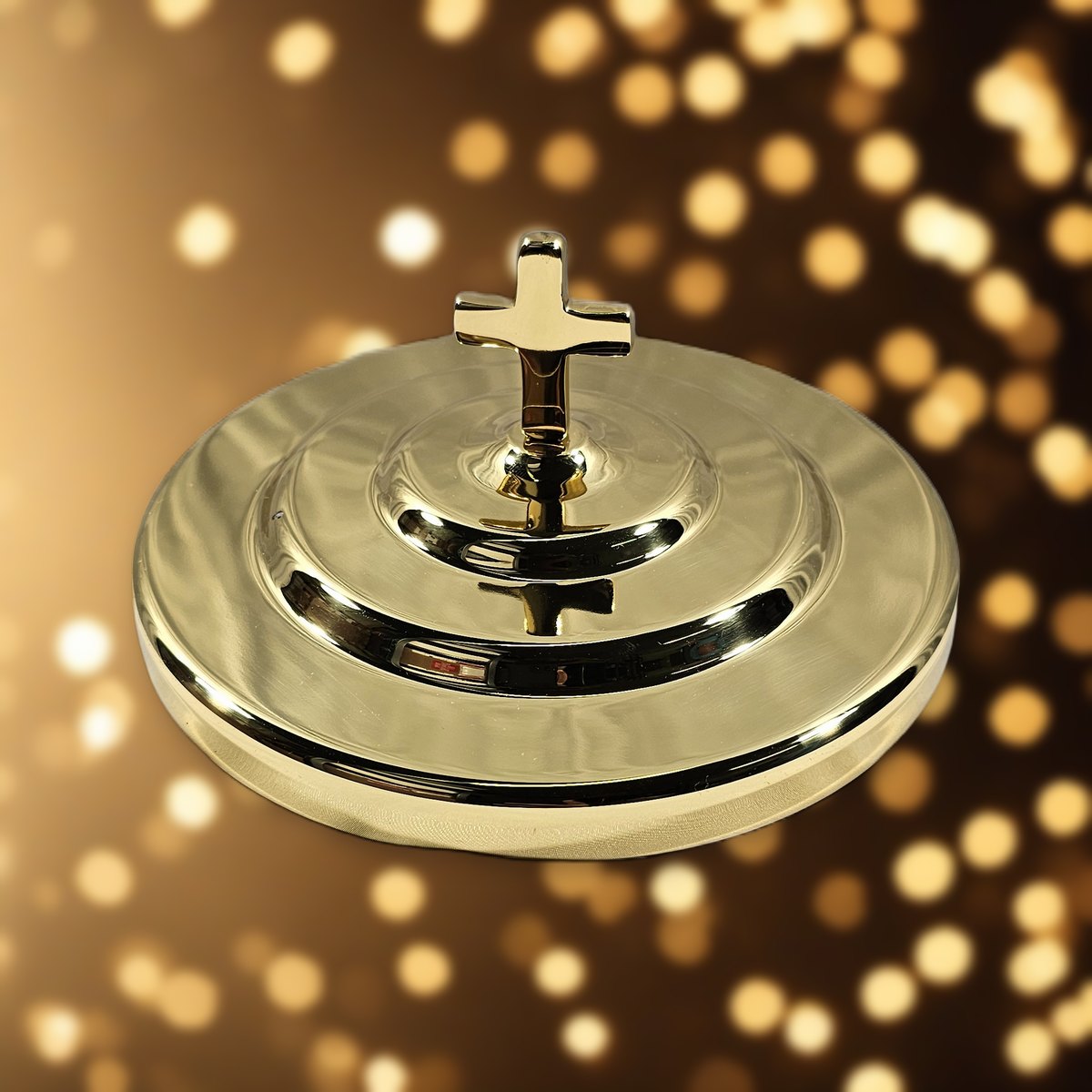 Bread Plate Cover with Cross - Solid Brass by Artistic against soft golden light