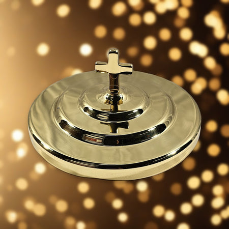Bread Plate Cover with Cross - Solid Brass by Artistic against soft golden light