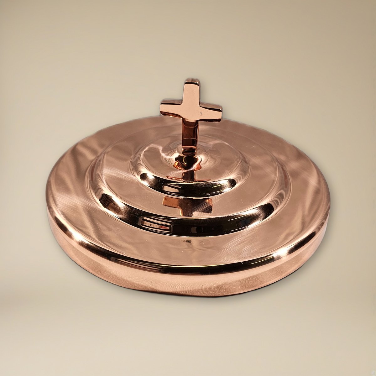 Bread Plate Cover with Cross - Solid Copper by Artistic on a cream backdrop