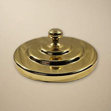 Bread Plate Cover with Plain Knob - Brasstone Aluminum by Artistic on a cream backdrop