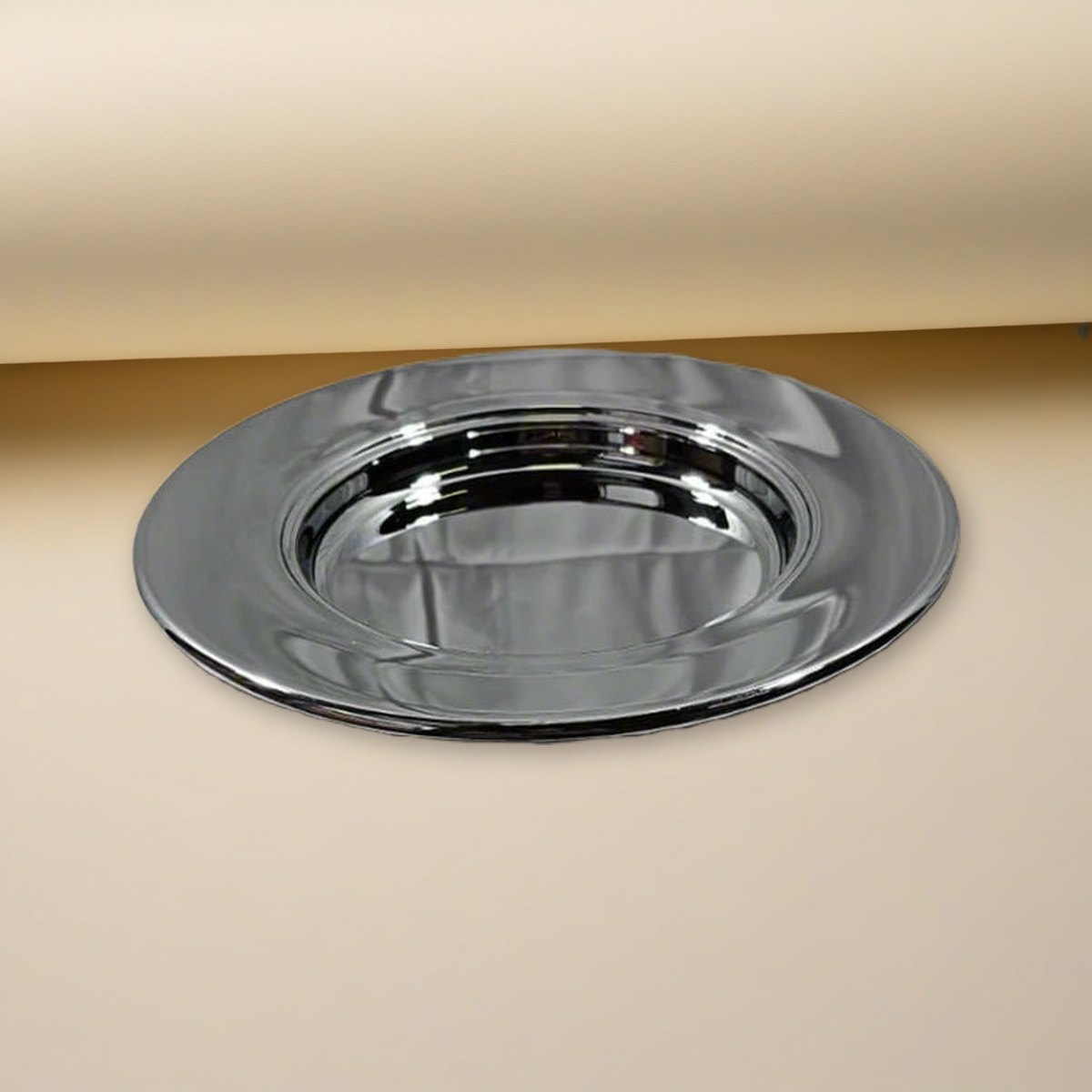 Bread Plate - Solid Chrome by Artistic on a cream backdrop