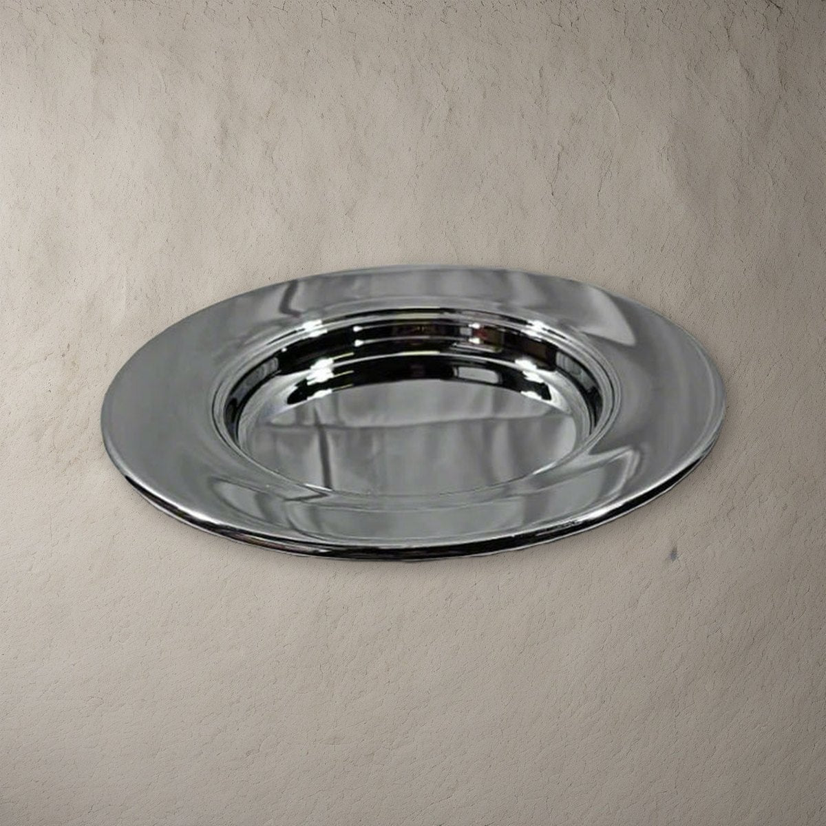 Bread Plate - Solid Chrome by Artistic on a stone background