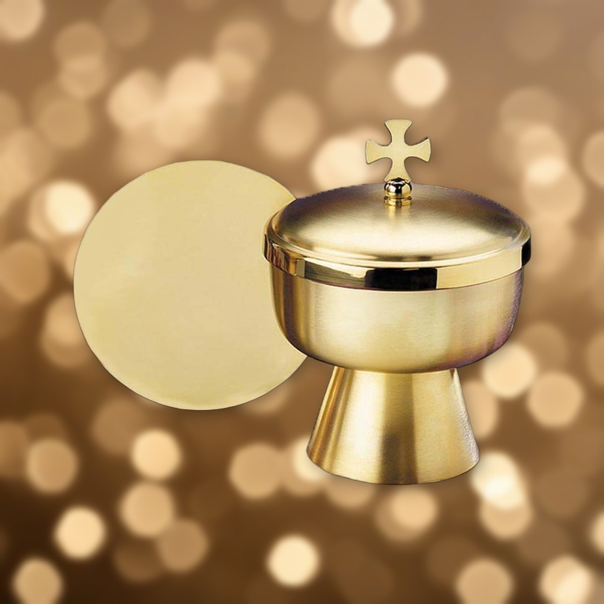 Ciborium with Cross Top against soft golden light