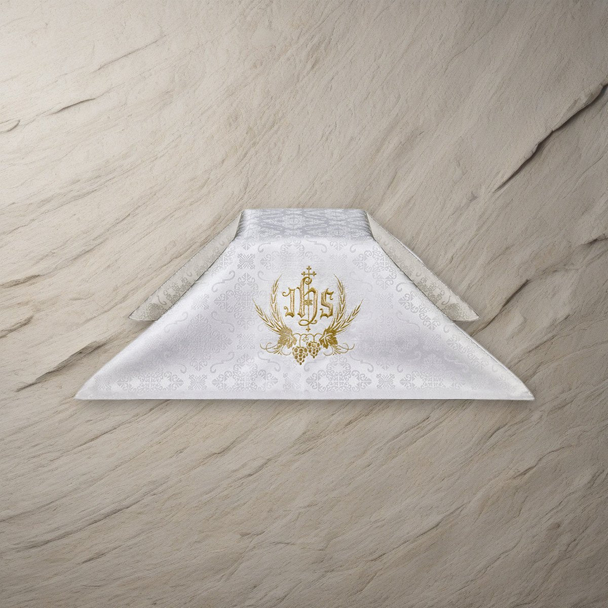 Embroidered IHS Chalice Veil on a stone background