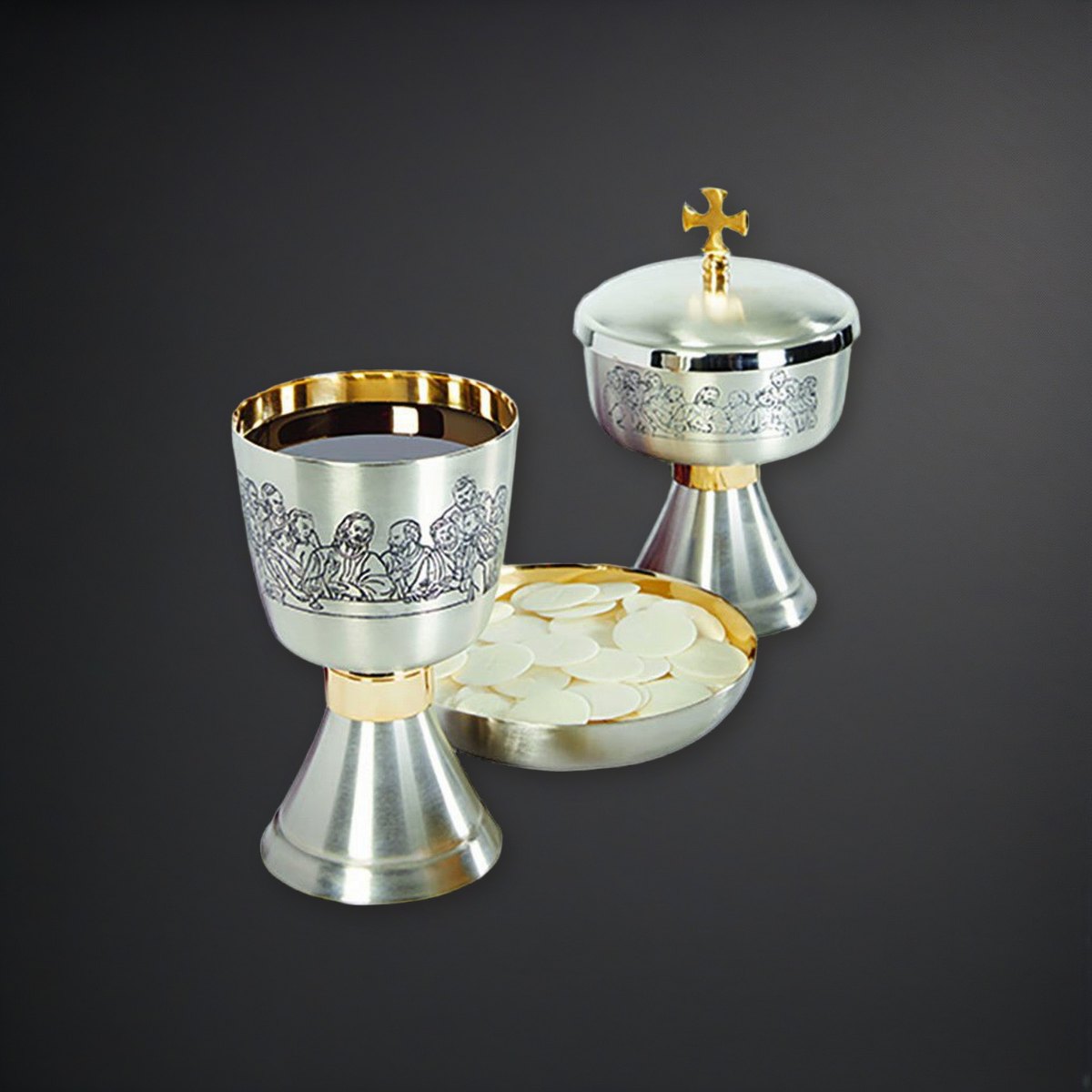 Last Supper Etched Chalice, Ciborium and Bowl Paten Set on a charcoal backdrop