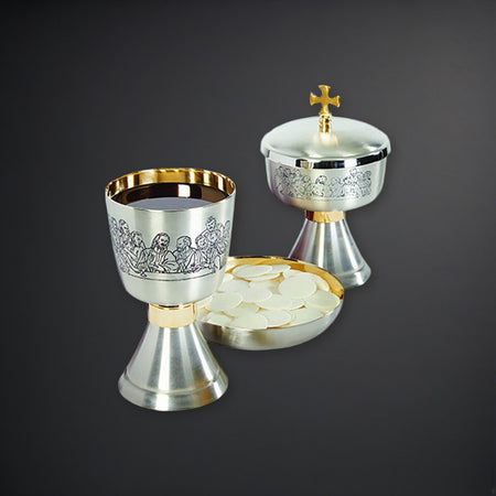Last Supper Etched Chalice, Ciborium and Bowl Paten Set on a charcoal backdrop