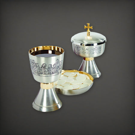 Last Supper Etched Chalice, Ciborium and Bowl Paten Set on a charcoal backdrop