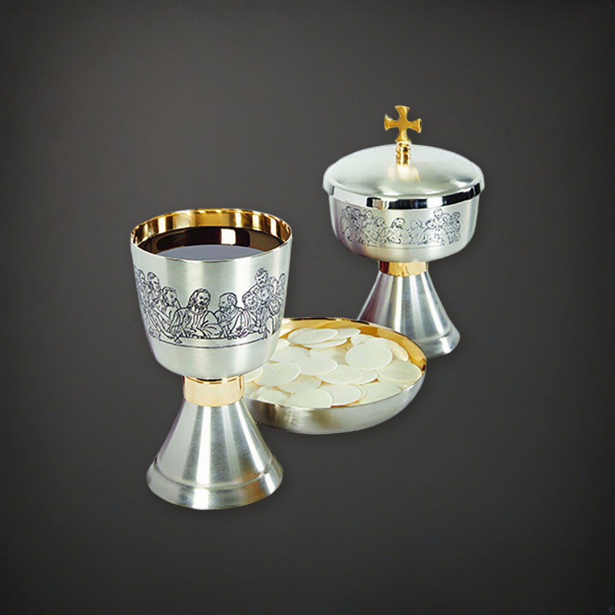 Last Supper Etched Chalice, Ciborium and Bowl Paten Set on a charcoal backdrop