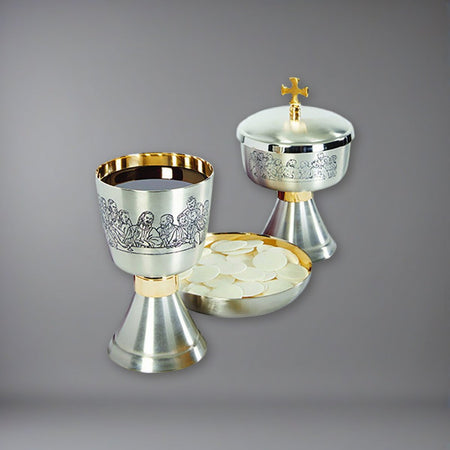 Last Supper Etched Chalice, Ciborium and Bowl Paten Set on a soft grey backdrop