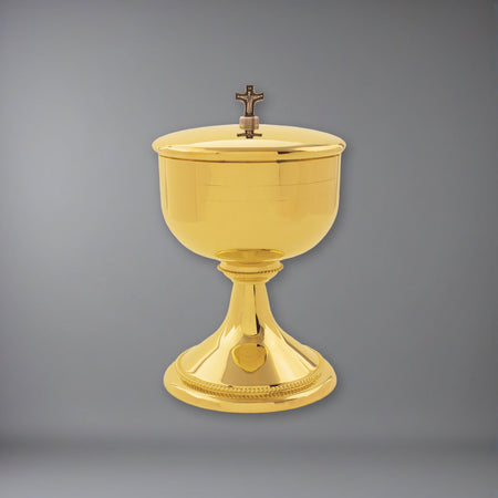 Our beautiful Ciborium plated in 24k gold on a soft grey backdrop