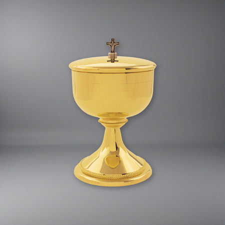 Our beautiful Ciborium plated in 24k gold on a soft grey backdrop