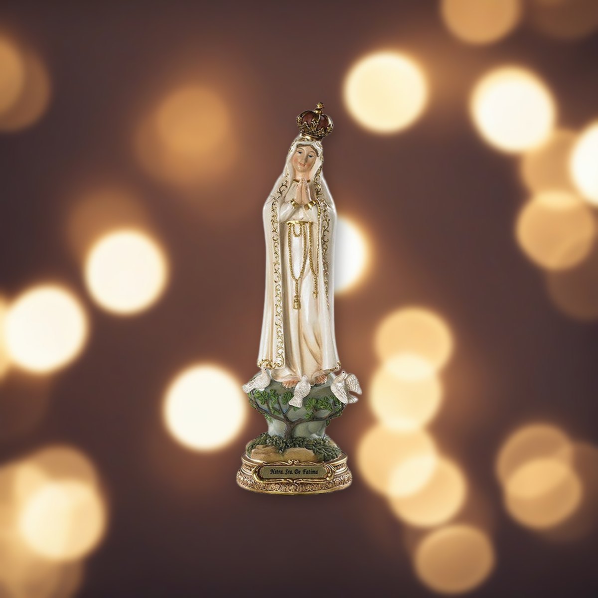 Our Lady of Fatima Statue against soft golden light