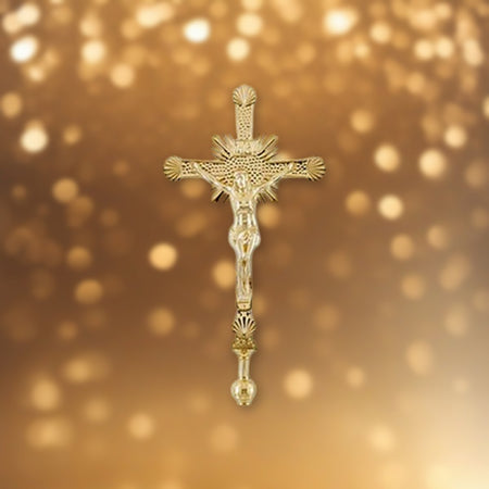 Processional Crucifix | Solid Brass against soft golden light