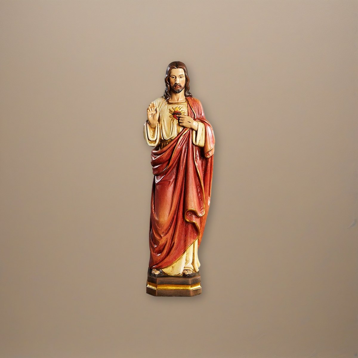12" H Sacred Heart Statue on a plaster background