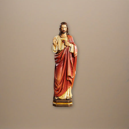 12" H Sacred Heart Statue on a plaster background