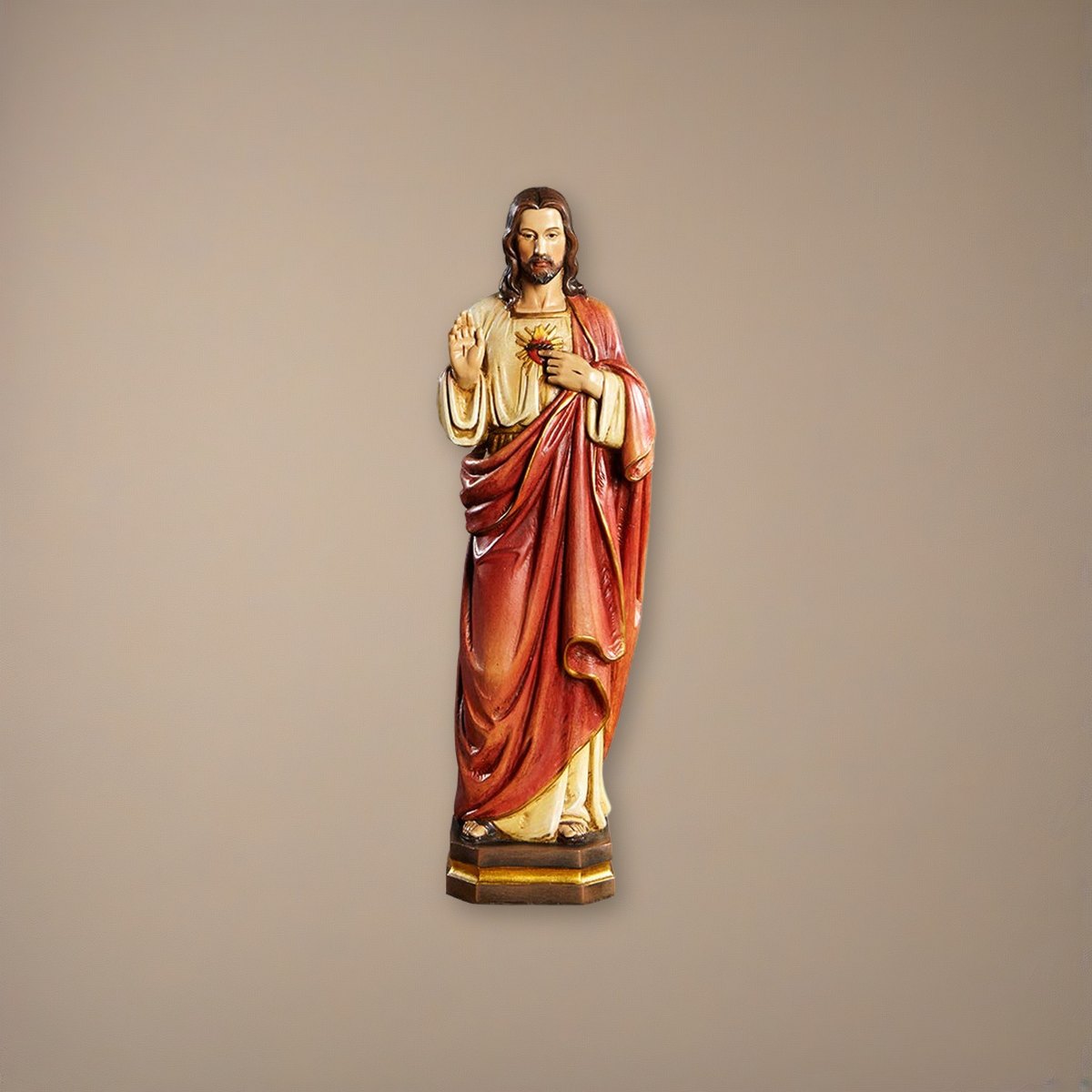 12" H Sacred Heart Statue on a plaster background