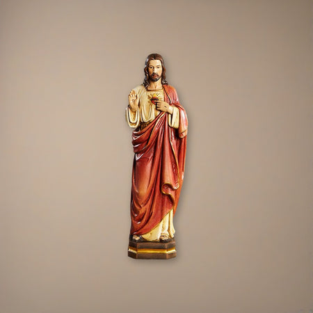 12" H Sacred Heart Statue on a plaster background