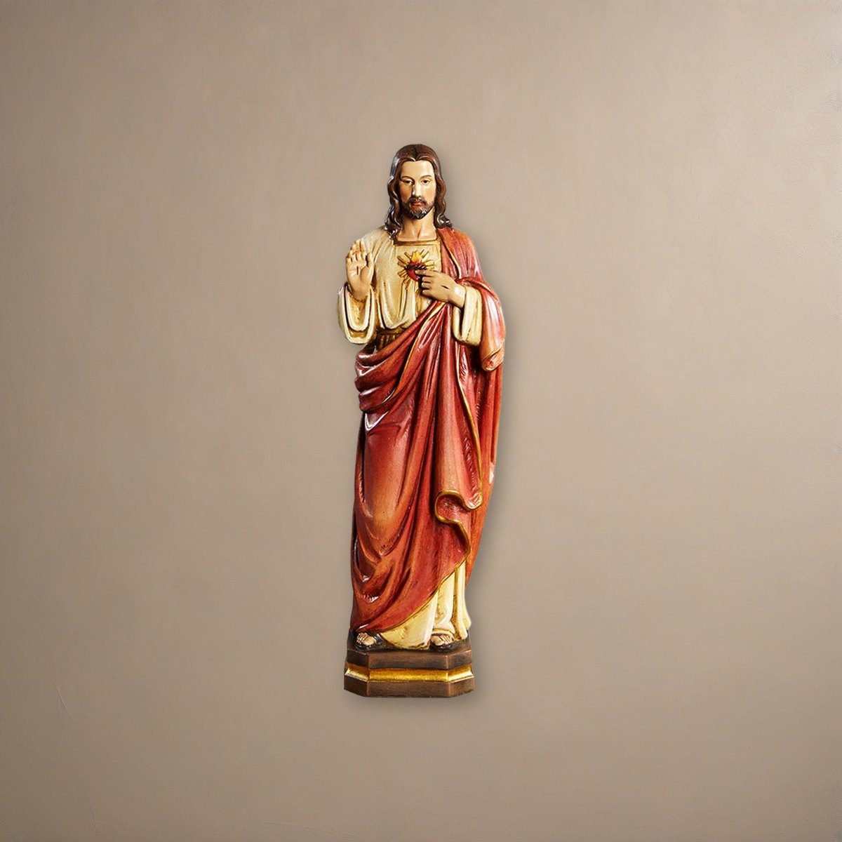 12" H Sacred Heart Statue on a plaster background