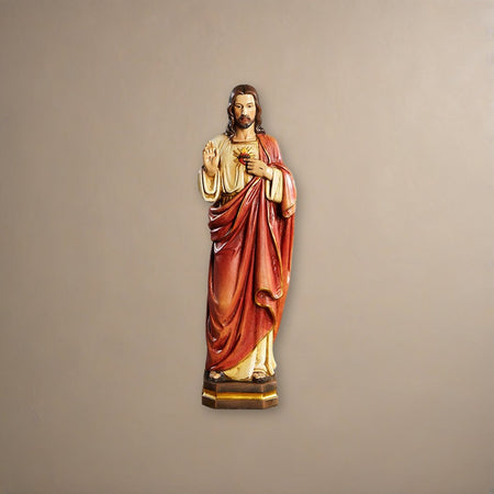 12" H Sacred Heart Statue on a plaster background