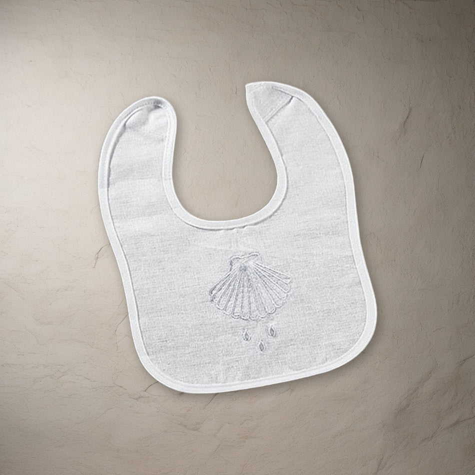 Shell & Water Embroidered Baptismal Bib 12/pk on a stone background