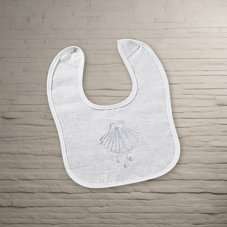 Shell & Water Embroidered Baptismal Bib 12/pk on a stone background