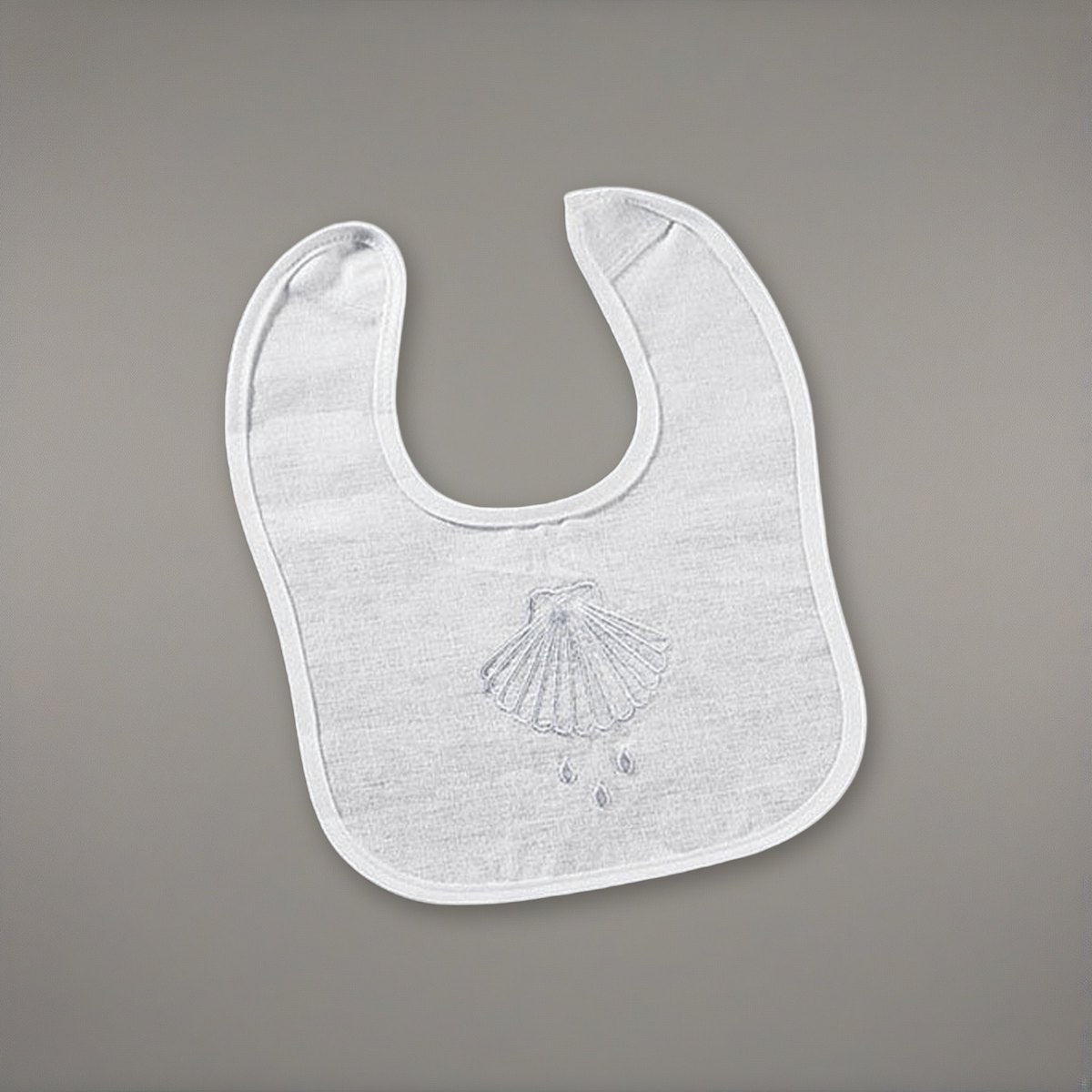 Shell & Water Embroidered Baptismal Bib 12/pk on a soft grey backdrop