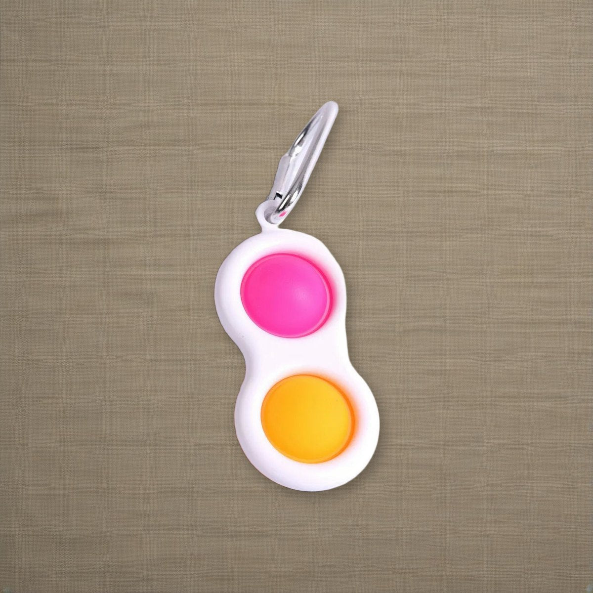 Peace Popper Key Chain Asst Colors Key Ring on natural linen