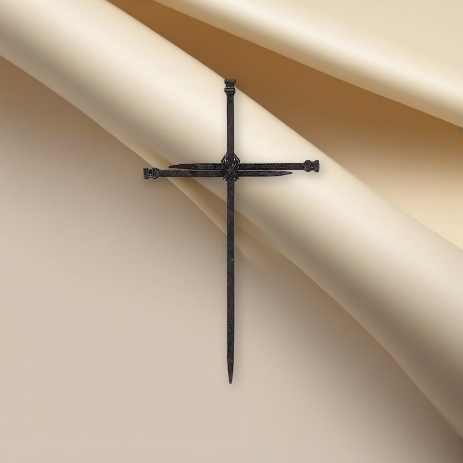 Tall Metal Nails Wall Cross on a cream backdrop