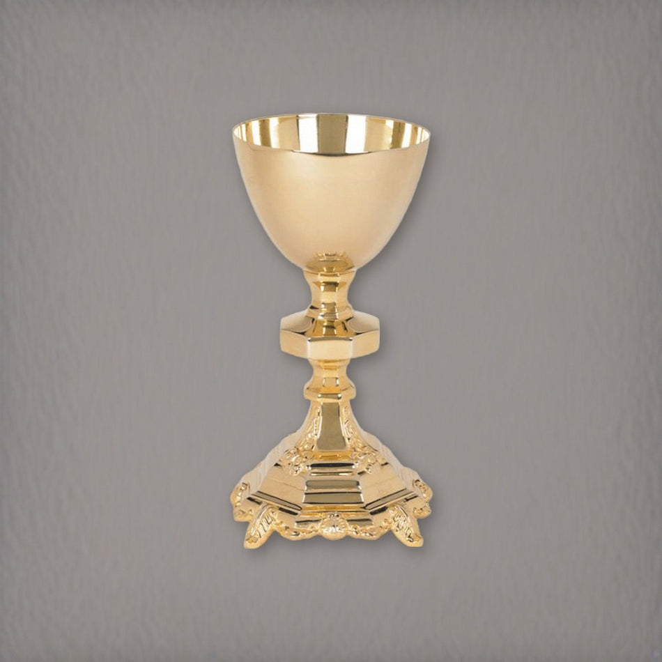 Traditional Chalice and Paten Set on a soft grey backdrop