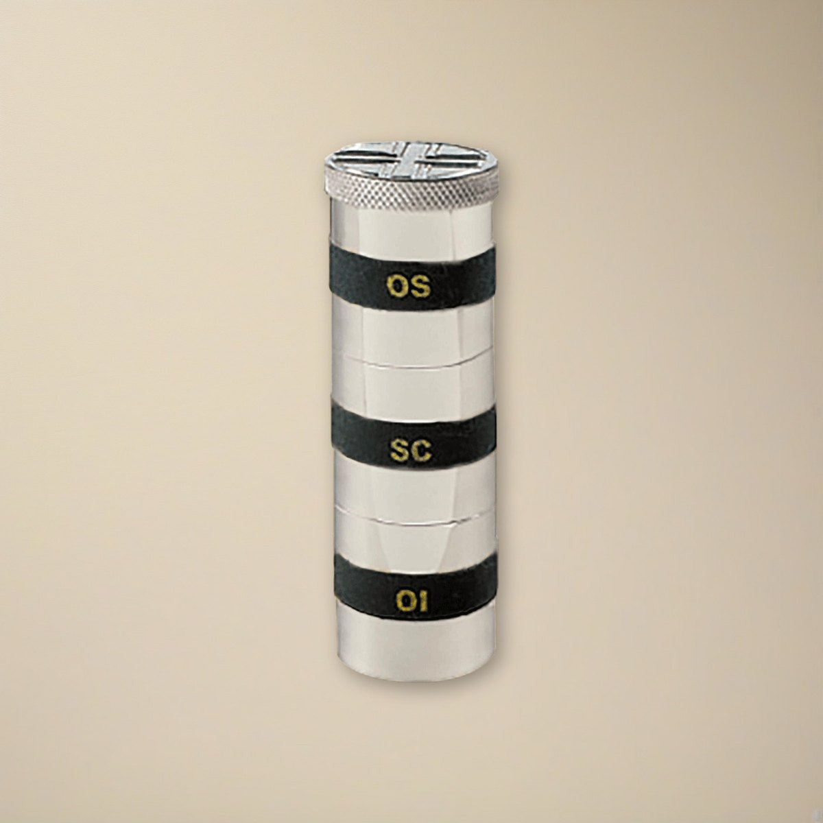 Triple Oil Stock on a cream backdrop