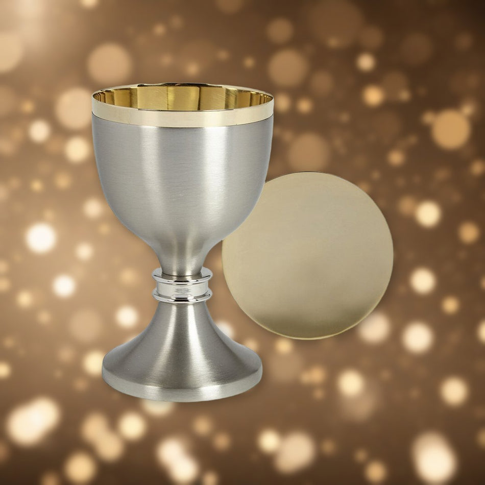 Two-Tone Chalice and Paten Set against soft golden light