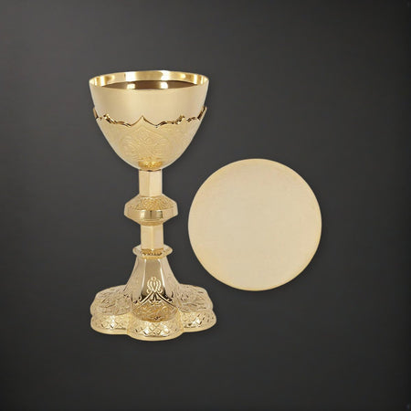 Vine Embossed Chalice and Paten Set on a charcoal backdrop