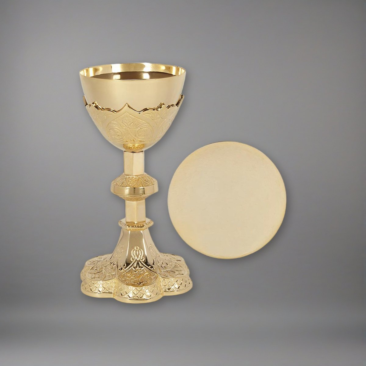 Vine Embossed Chalice and Paten Set on a soft grey backdrop