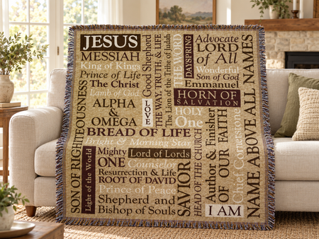 Names of Jesus cotton tapestry throw displayed on a sofa; AI-assisted lifestyle illustration